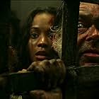 David Bailie, Kevin McNally, and Zoe Saldana in Pirates of the Caribbean: The Curse of the Black Pearl (2003)
