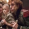 Helena Bonham Carter, Sacha Baron Cohen, and Isabelle Allen in Les Misérables (2012)
