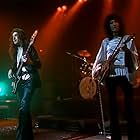 Brian May, John Deacon, and Queen in Queen: Live at the Rainbow (1992)