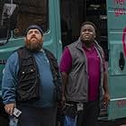 Nick Frost and Samson Kayo in The Watcher on the Water (2020)