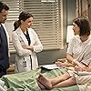 Justin Chambers, Caterina Scorsone, Steele Gagnon, and Caitlin McGee in Grey's Anatomy (2005)