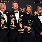 Charlie Brooker and the "Black Mirror" crew pose with the Emmy for Outstanding Writing for a Limited Series, Movie, or Dramatic Special during the 69th Emmy Awards