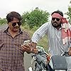 Raghubir Yadav and Faisal Malik in Panchayat (2020)
