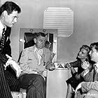 Robert Mitchum, John Cromwell, Robert Ryan, and Lizabeth Scott in The Racket (1951)