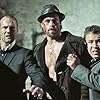 Brad Pitt, Jason Statham, and Stephen Graham in Snatch (2000)