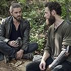 Tom Payne and Ross Marquand in The Walking Dead (2010)
