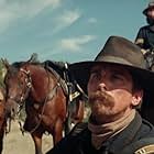Christian Bale, Rory Cochrane, and Jonathan Majors in Hostiles (2017)