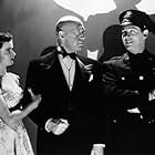 Joan Bennett, Milton Berle, and Otto Preminger in Margin for Error (1943)