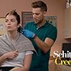 Dustin Milligan and Annie Murphy in Schitt$ Creek (2015)