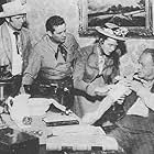 Cliff Clark, Tim Holt, Dorothy Malone, and Richard Martin in Saddle Legion (1951)