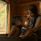Freida Pinto and Rohan Chand in Mowgli: Legend of the Jungle (2018)