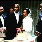 Denzel Washington, Angela Bassett, James McDaniel, and Ernest Thomas in Malcolm X (1992)