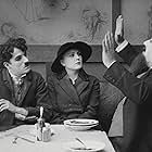 Charles Chaplin, Henry Bergman, and Edna Purviance in The Immigrant (1917)