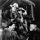 John Wayne, George Bancroft, Andy Devine, and Francis Ford in Stagecoach (1939)
