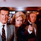 Michael Caine, Sally Kirkland, and Roger Moore in Bullseye! (1990)