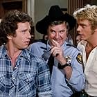 James Best, John Schneider, and Tom Wopat in The Dukes of Hazzard (1979)