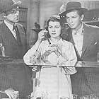Rita Hayworth, Bruce Cabot, and Robert Paige in Homicide Bureau (1939)