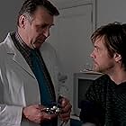 Jim Carrey and Tom Wilkinson in Eternal Sunshine of the Spotless Mind (2004)