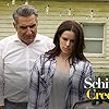 Emily Hampshire and Eugene Levy in Schitt$ Creek (2015)