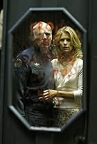 Michael Hogan and Kate Vernon in Battlestar Galactica (2004)
