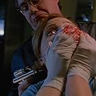 Gillian Anderson and John Billingsley in The X-Files (1993)