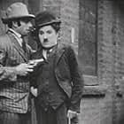 Charles Chaplin and Wesley Ruggles in Triple Trouble (1918)