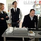 Jonny Lee Miller, Lucy Liu, and Eric Elizaga in Elementary (2012)