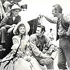 William Holden, Glenn Ford, George Marshall, and Claire Trevor in Texas (1941)