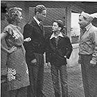 William Bakewell, Sumner Getchell, Robert 'Buzz' Henry, and Jennifer Holt in Hop Harrigan America's Ace of the Airways (1946)