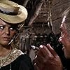 Claudia Cardinale and Lionel Stander in C'era una volta il West (1968)