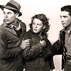 Glenn Ford, Richard Conte, and Jean Rogers in Heaven with a Barbed Wire Fence (1939)