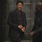 Sung Kang and Tyrese Gibson in F9: The Fast Saga (2021)