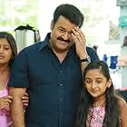 Mohanlal, Ansiba, and Esther Anil in Drishyam (2013)