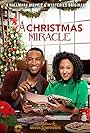Tamera Mowry-Housley and Brooks Darnell in A Christmas Miracle (2019)