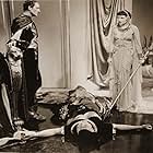 Claudette Colbert, Leonard Mudie, and Warren William in Cleopatra (1934)
