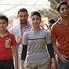Aamir Khan, Ritvik Sahore, Zaira Wasim, and Suhani Bhatnagar in Dangal (2016)
