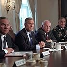 George W. Bush, Dick Cheney, Colin Powell, and Hugh Shelton in The Untold History of the United States (2012)