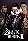 Rowan Atkinson, Tim McInnerny, and Tony Robinson in Blackadder II (1986)
