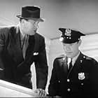 Tom Kennedy and John Ridgely in Blondes at Work (1938)