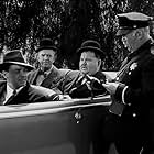 Oliver Hardy, James Bush, Edgar Dearing, Stan Laurel, and Philip Van Zandt in The Big Noise (1944)