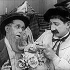Hank Mann and James T. Kelley in An Eye for Figures (1920)