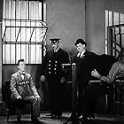 Oliver Hardy, Stan Laurel, and Tiny Sandford in Pardon Us (1931)