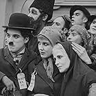 Charles Chaplin, Albert Austin, Kitty Bradbury, and Edna Purviance in The Immigrant (1917)