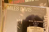 Author’s photo of their copies of the Miles Davis CD albums Kind of Blue on both Not Now and the Dual Disc version from Columbia Legacy, and The Complete Birth of the Cool on Capitol