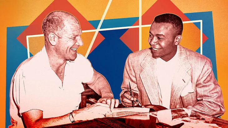 Color photo of Bill Veeck with Larry Doby.