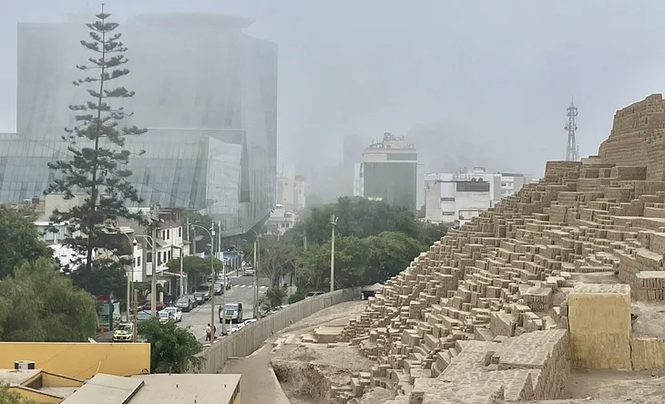 The Ancient Pyramid Surrounded by Apartment Buildings