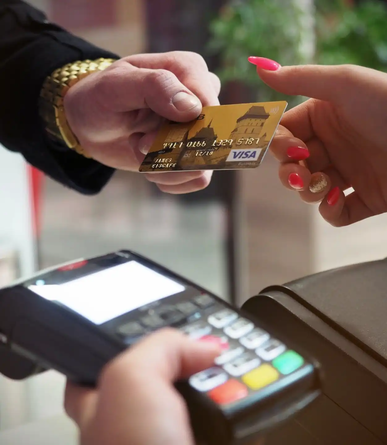 a person offering a gold credit card