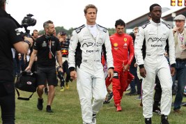NORTHAMPTON, ENGLAND - JULY 09: Brad Pitt, star of the upcoming Formula One based movie, Apex, and Damson Idris, co-star of the upcoming Formula One based movie, Apex, walk on the grid during the F1 Grand Prix of Great Britain at Silverstone Circuit on July 09, 2023 in Northampton, England. (Photo by Ryan Pierse/Getty Images)