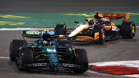 Aston Martin's Fernando Alonso is followed by McLaren's Oscar Piastri during Formula 1's 2024 Bahrain Grand Prix.