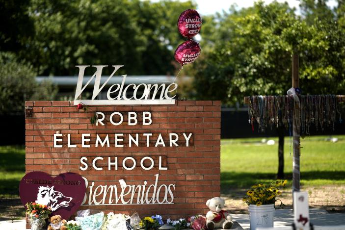 This photo taken on May 24, 2023 shows flowers and toys placed to mourn for victims of a school mass shooting at the former Robb Elementary School in Uvalde, Texas, the United States. The one-year anniversary of the school shooting killing 19 pupils and two teachers in Uvalde in the U.S. state of Texas arrives on Wednesday, marked by deep frustration as gun violence appears more rampant across the country. (Photo by Wu Xiaoling/Xinhua via Getty Images)